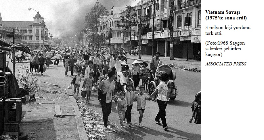 A towering cloud of smoke marks the area in Saigon's Oholon section on Feb. 12, 1968 where Allied troops and Viet Cong guerrillas are battling forcing thousands of refugees to flee. (AP Photo) Associated Press